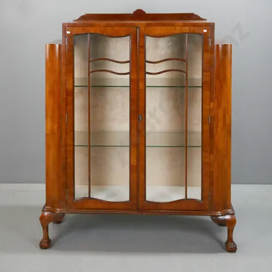 vintage walnut Art Nouveau-style display case w/ stepped top, 2 shaped glazed doors w/ beaded shaped astragal, glazed