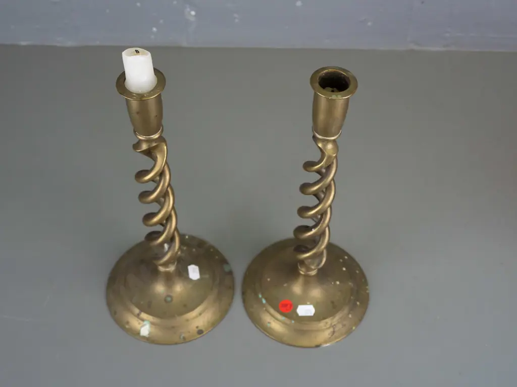 pair of Victorian brass open twist candlesticks on circular base. Discolouration to brass, wax staining. H-310 D-135 Image 1++