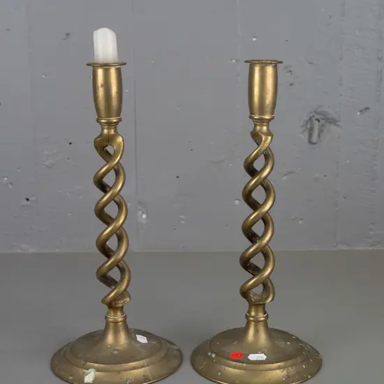 pair of Victorian brass open twist candlesticks on circular base. Discolouration to brass, wax staining. H-310 D-135