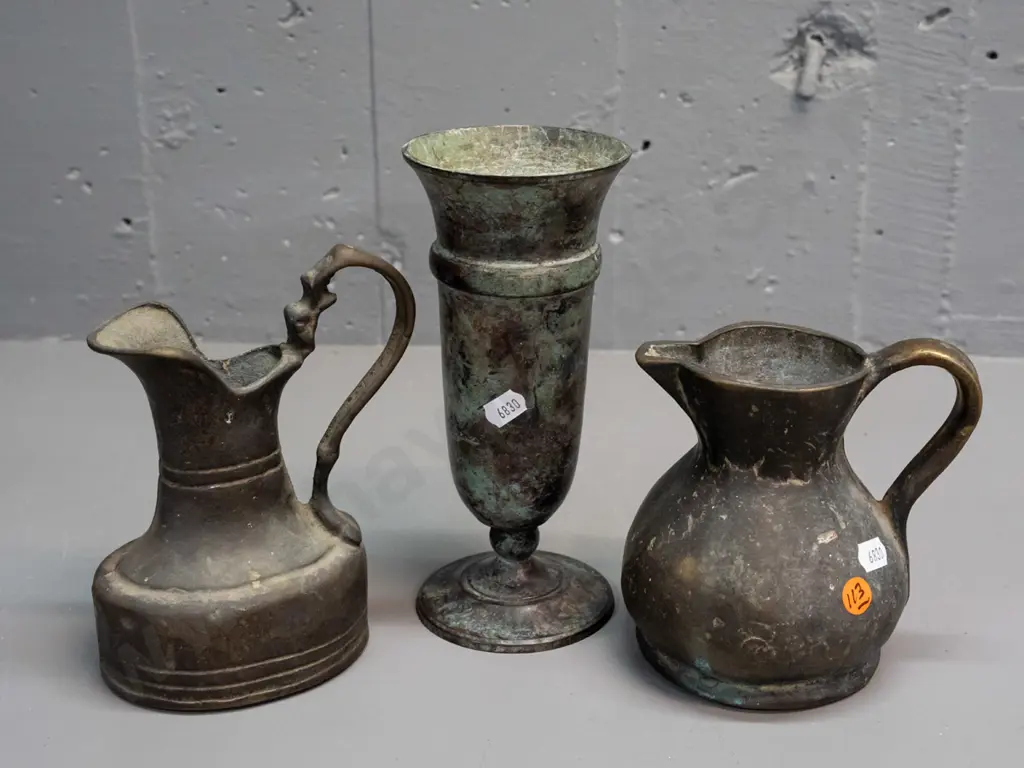 2 heavy cast brass jugs and a patina'd metal footed vase H-200 Image 1++