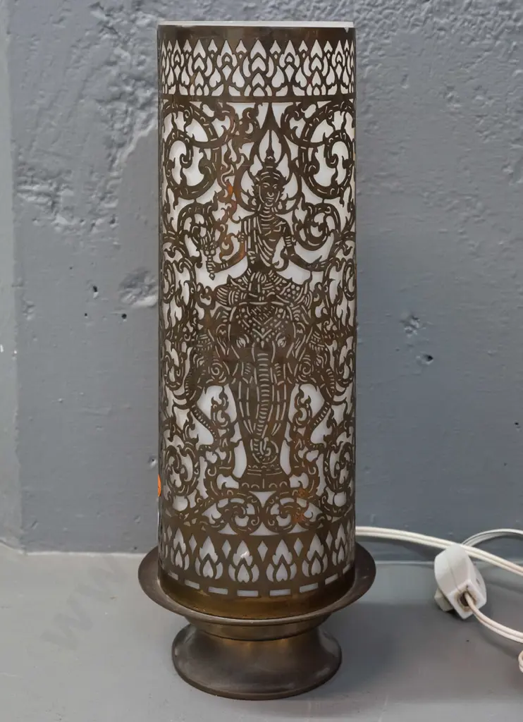 cylindrical pierced brass table lamp with frosted glass shade, on spun brass base - Thai or Indian motifs - some dents Image 1++