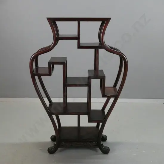 Chinese hardwood vase-shaped display stand with shaped sides, swirling foliate feet, pierced frieze at bottom - minor