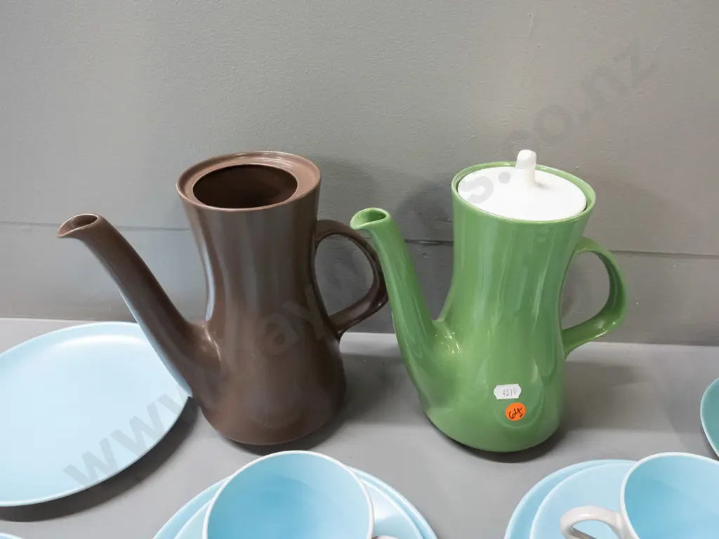 Poole coffee ware in various colours - two coffee pots, 4 trios, cup, bowl and 2 plates. One coffee pot is missing lid. Image 1++