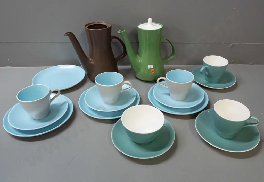 Poole coffee ware in various colours - two coffee pots, 4 trios, cup, bowl and 2 plates. One coffee pot is missing lid. Image 1++