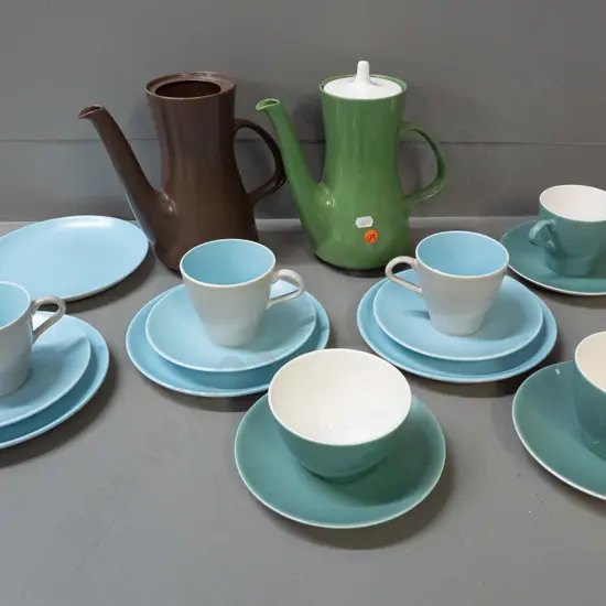 Poole coffee ware in various colours - two coffee pots, 4 trios, cup, bowl and 2 plates. One coffee pot is missing lid.