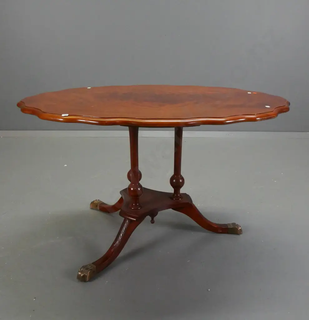 reproduction side table with figured mahogany top with shaped edge, 3-leg cathedral style platform base with brass lion Image 1++