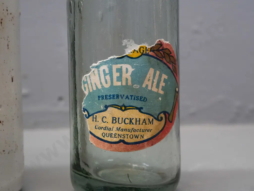 3 vintage bottles - Buckham Queenstown ginger ale marble bottle with part label, Meek's Inks Dunedin stoneware (chip in Image 1++