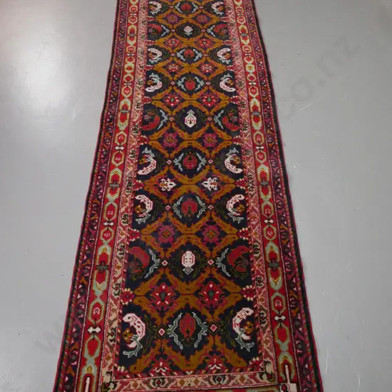 asian style wool floor runner with organic motifs in red, blue, teal and mustard tones - some wear. L-3200 W-800