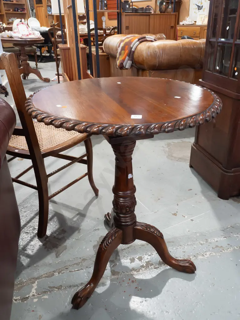 reproduction mahogany Chippendale style wine table with gadrooned edge, fluted stem, 3-point carved base on paw feet. Image 1++