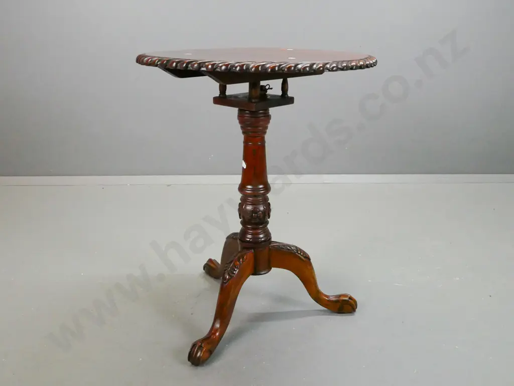 reproduction mahogany Chippendale style wine table with gadrooned edge, fluted stem, 3-point carved base on paw feet. Image 1++