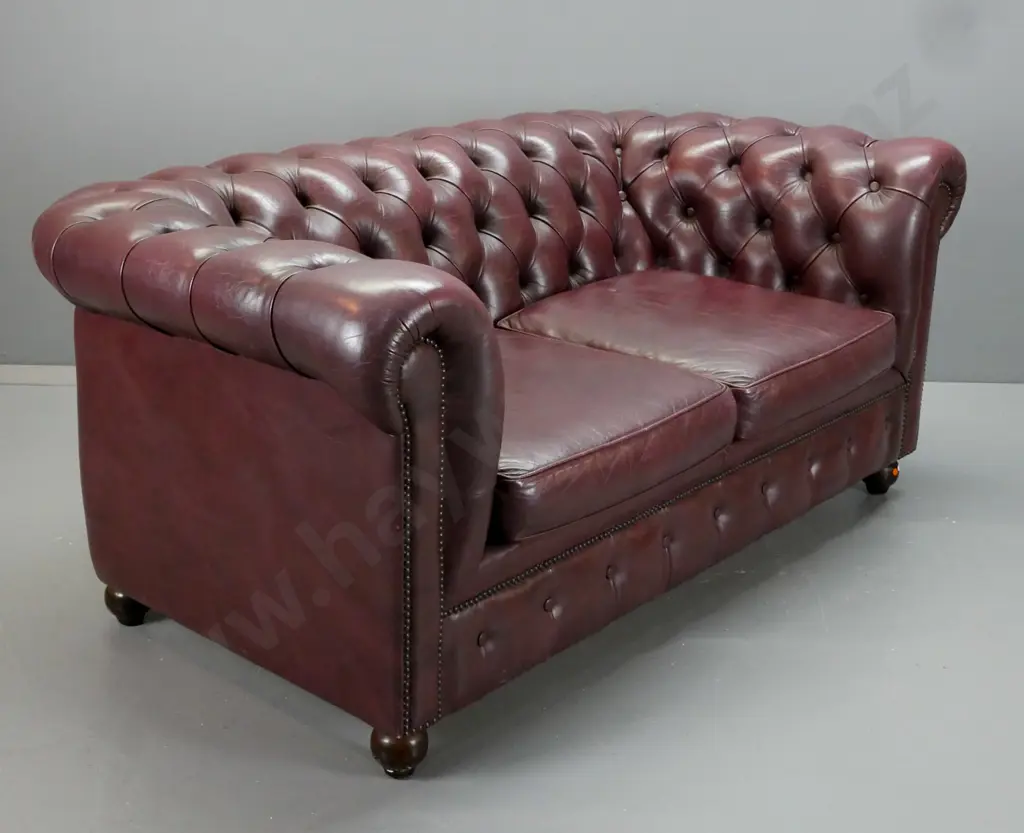 dark burgundy leather 2-seater rolled arm deep-button settee with domed front trim, 2 pop-out seat cushions - some wear Image 1++