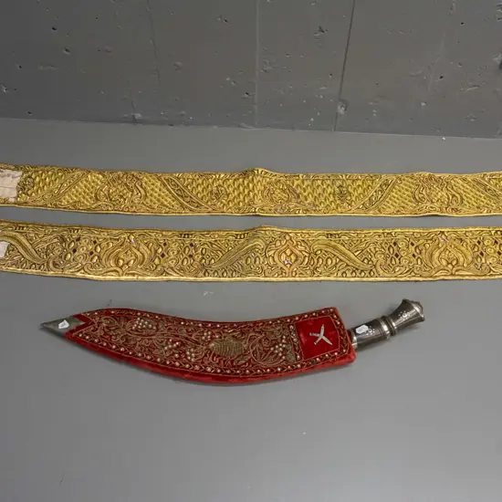 kukri knife with bead and metal thread decoration over fabric covered sheath, and 2 pieces of Yemen jambiya belt
