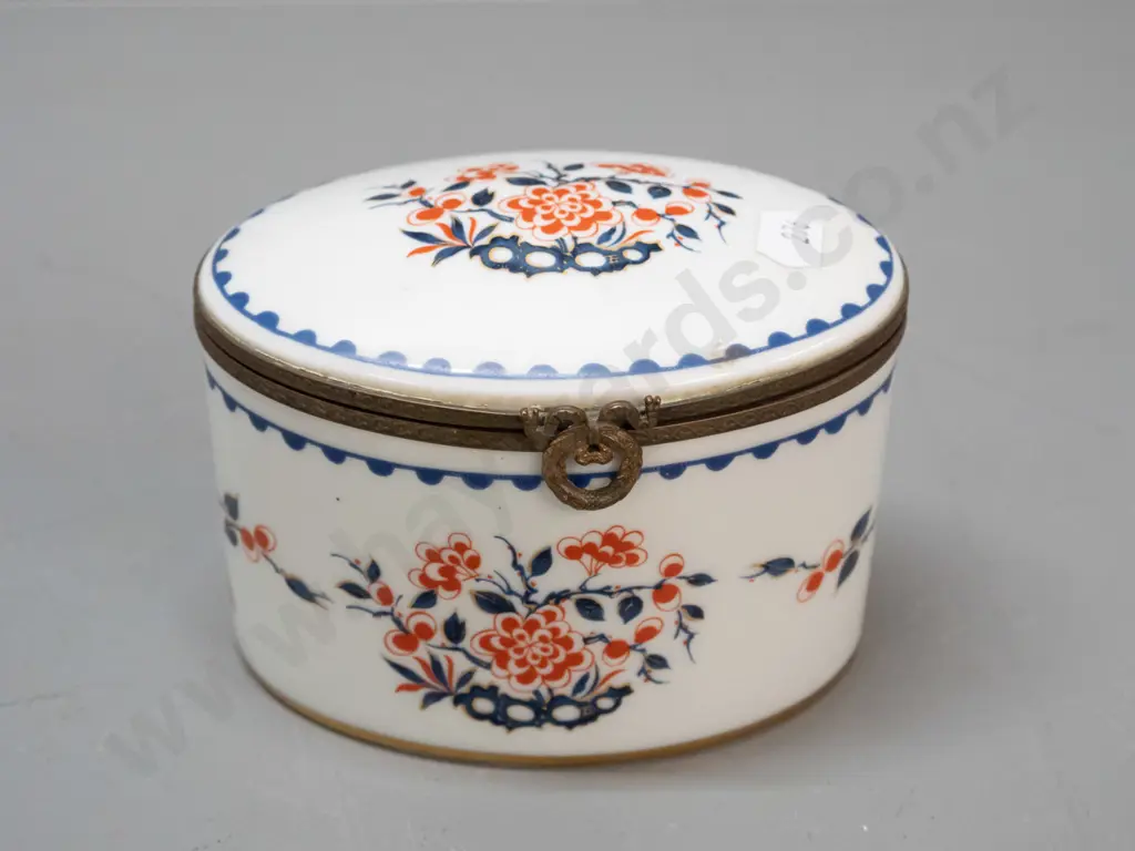 vintage lidded porcelain oval casket with cast brass fittings, gilt bottom rim. Porcelain de France mark and label, lid Image 1++