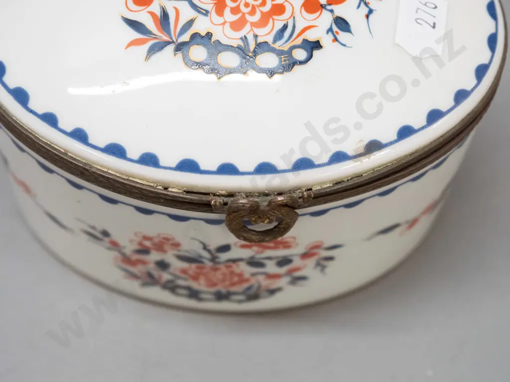 vintage lidded porcelain oval casket with cast brass fittings, gilt bottom rim. Porcelain de France mark and label, lid Image 1++