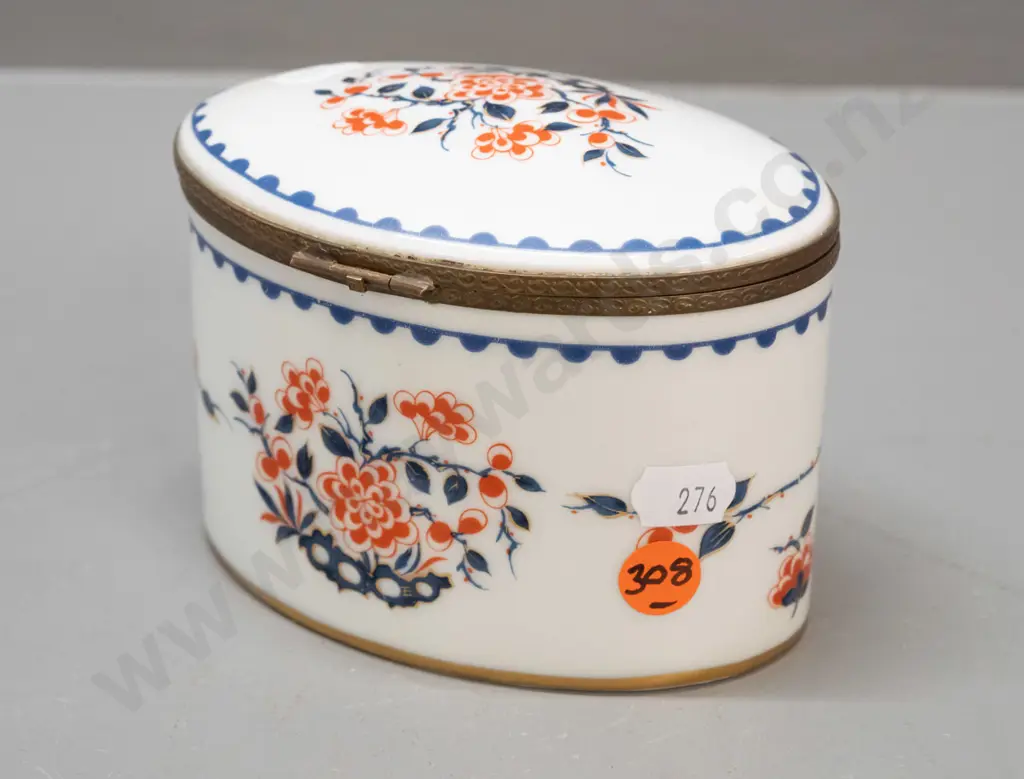 vintage lidded porcelain oval casket with cast brass fittings, gilt bottom rim. Porcelain de France mark and label, lid Image 1++