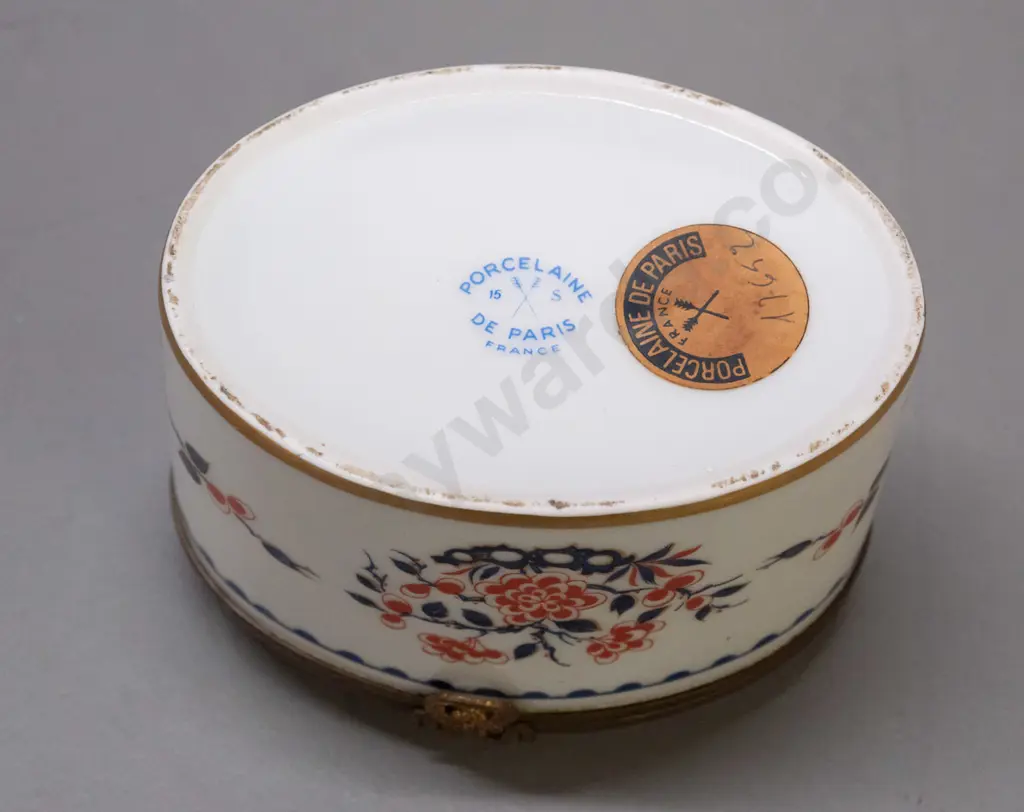 vintage lidded porcelain oval casket with cast brass fittings, gilt bottom rim. Porcelain de France mark and label, lid Image 1++