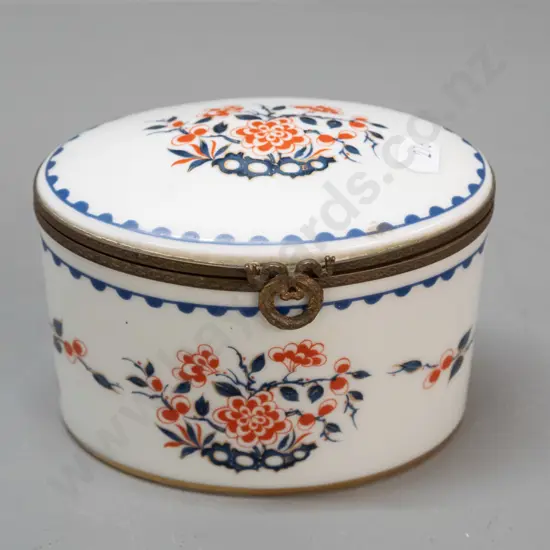vintage lidded porcelain oval casket with cast brass fittings, gilt bottom rim. Porcelain de France mark and label, lid