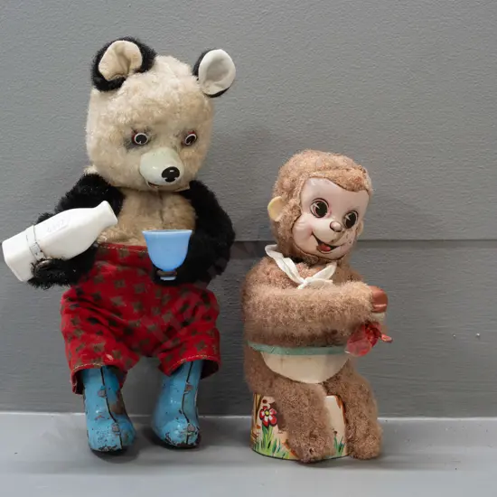 2 vintage wind-up toys - monkey with scrubbing brush, missing other hand - and a Panda pouring a drink - monkey marked