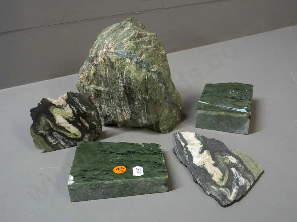 pieces of cut and partly polished stone - green stone with quartz and other veins - one piece has blue paint residue. Image 1++