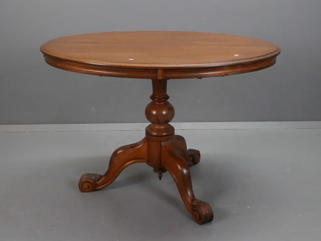 colonial kauri oval-top pedestal-based tea or breakfast table, turned column w/ 3 sweeping legs, swirled carved foliate Image 1++