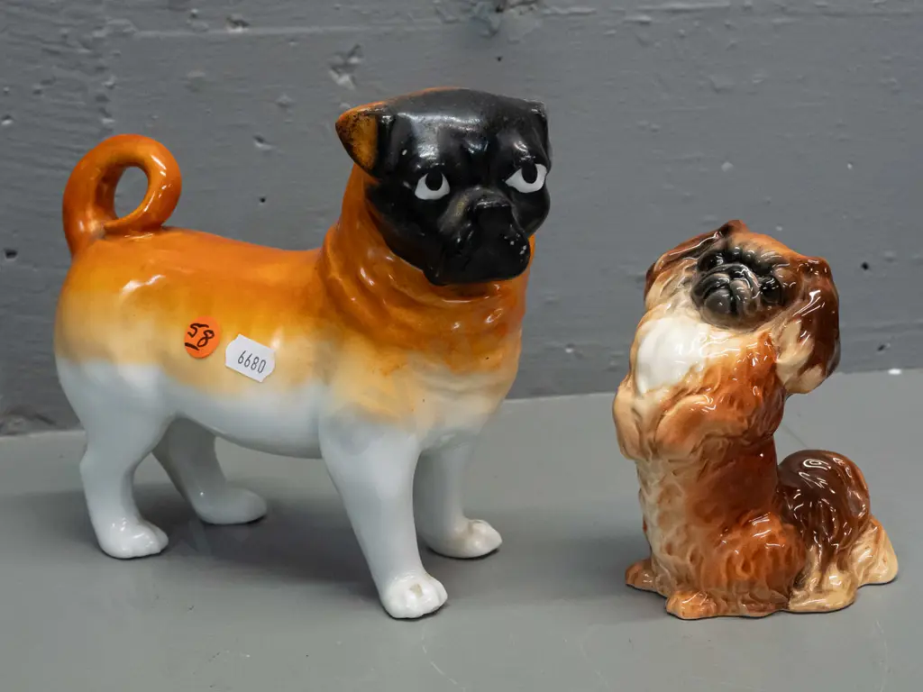2 dog figures - Beswick begging Pekinese H-120 and a vintage pug, no maker's marks H-165 L-180. Pug has minor chipping Image 1++