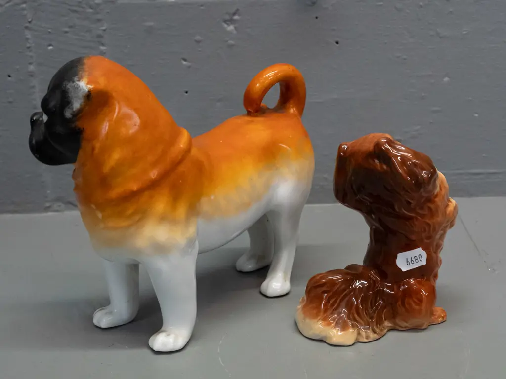 2 dog figures - Beswick begging Pekinese H-120 and a vintage pug, no maker's marks H-165 L-180. Pug has minor chipping Image 1++