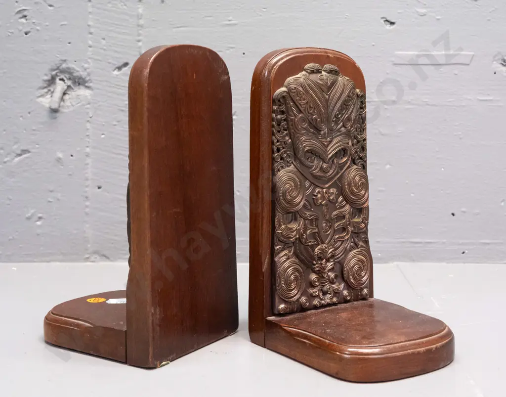 pair of Maori themed (mahogany?) timber book ends with applied cast copper-finish decoration - label on base: Exclusive Image 1++