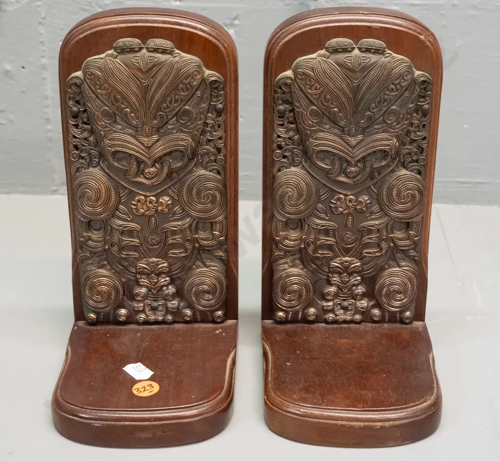 pair of Maori themed (mahogany?) timber book ends with applied cast copper-finish decoration - label on base: Exclusive Image 1++