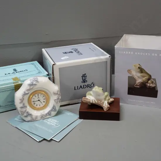 2 Lladro items with original boxes - "Lucky Frog" on wooden base and a quartz clock in porcelain case H-90 W-90