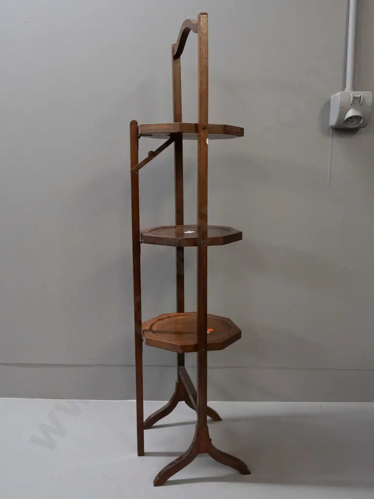 vintage mahogany 3-tier folding cake plate stand with octagonal plate supports. Has had small repair to one leg. H-960 Image 1++