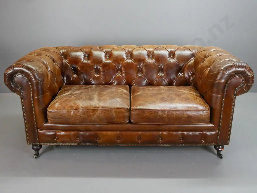 brown leather deep button and pleated rolled-arm chesterfield 2-seater settee with brass studded front and sides, on Image 1++