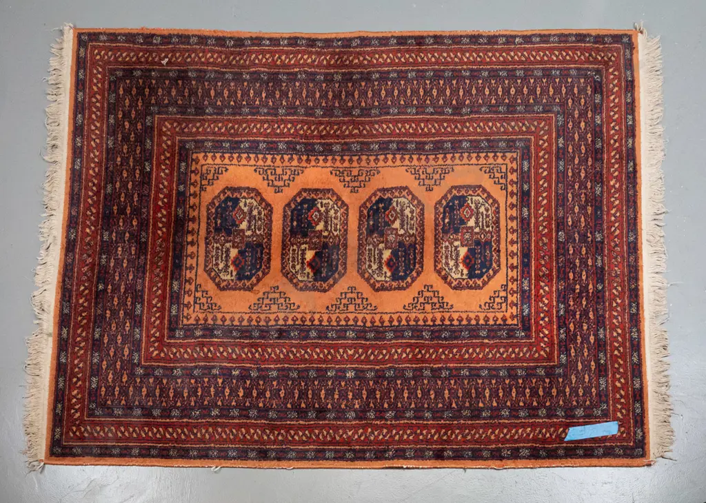 Persian style wool floor rug - terracotta, reds and blue - some wear to pile, fading & minor staining L-1750 W-1340 Image 1++