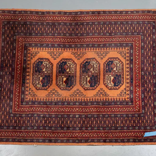 Persian style wool floor rug - terracotta, reds and blue - some wear to pile, fading & minor staining L-1750 W-1340
