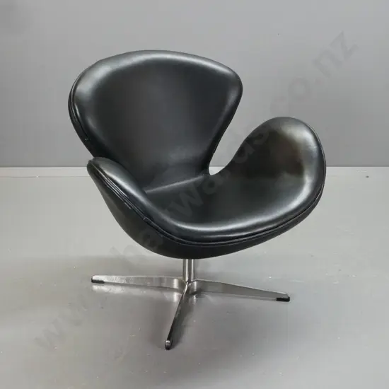 Arne Jacobsen style black leather swan chair on chrome X-frame base, piped edging - minor scratches and scrapes to