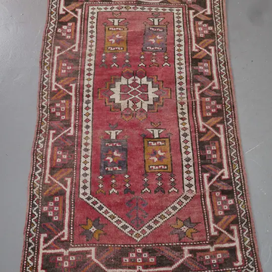 small tribal style hand knotted wool floor rug - red, brown blue and mustard, heavily faded and worn L-1400 W-810