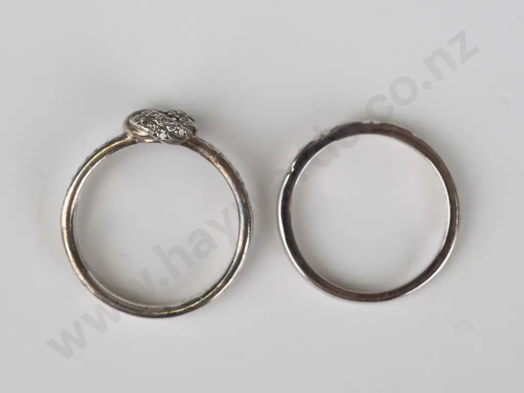 2 silver cz rings both stamped 925 Image 1++