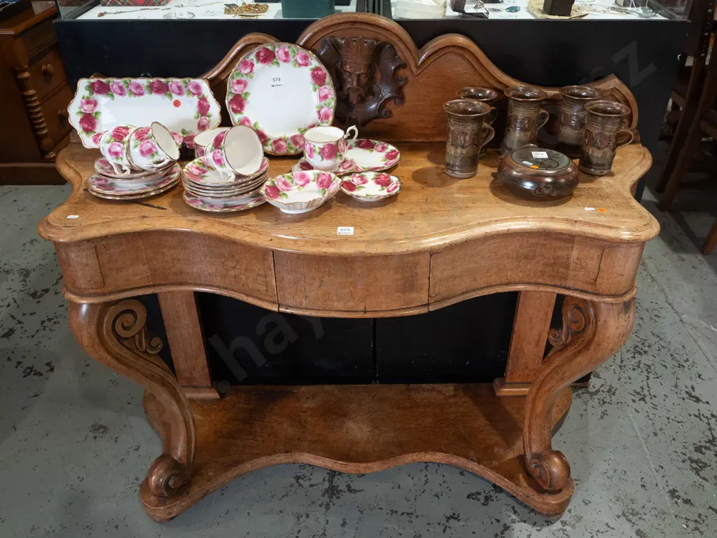 Victorian oak console table with shaped upstand, figural carving in shaped roundel, scrolling carved front legs on Image 1++