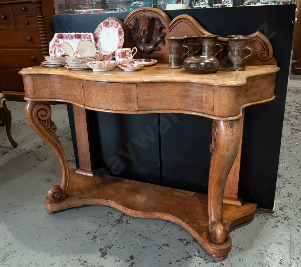 Victorian oak console table with shaped upstand, figural carving in shaped roundel, scrolling carved front legs on Image 1++