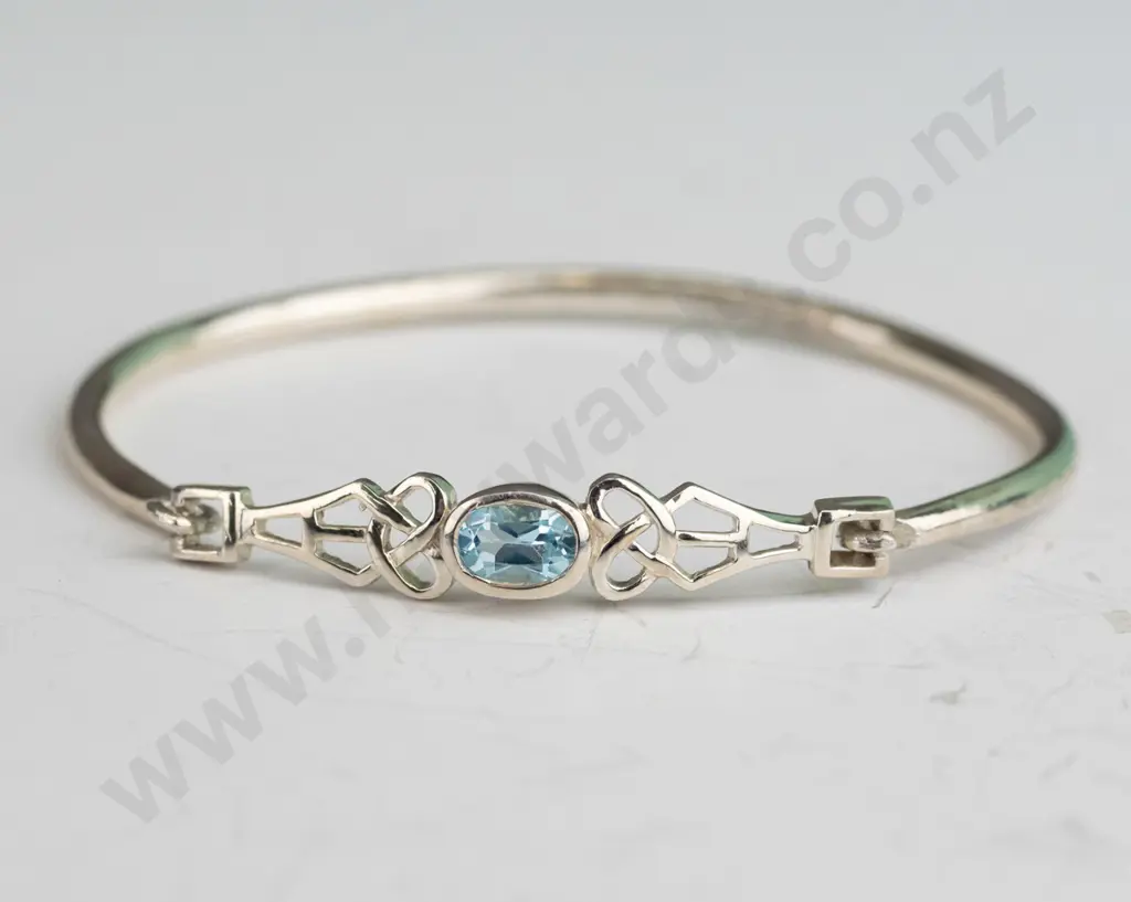 silver bangle with light blue stone stamped 925 Image 1++