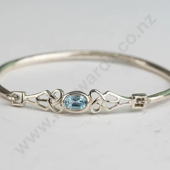 silver bangle with light blue stone stamped 925
