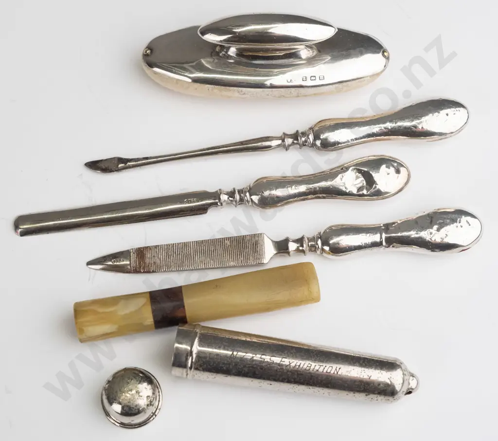 silver manicure set marked with anchor, lion, M & silver pipe mouth piece container with mouth piece engraved from the Image 1++