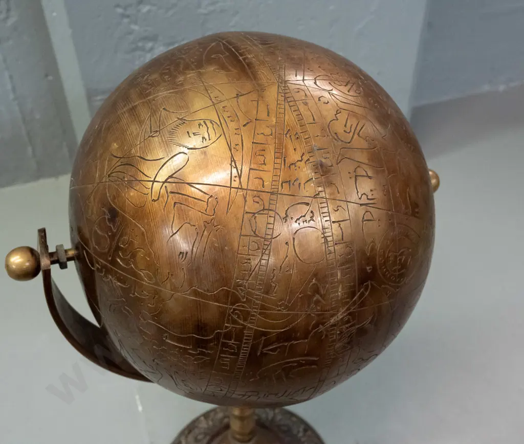 very heavy brass globe on rotating mount and stem, on circular base - globe is incised with script, animal and human Image 1++