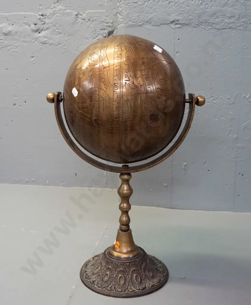very heavy brass globe on rotating mount and stem, on circular base - globe is incised with script, animal and human Image 1++