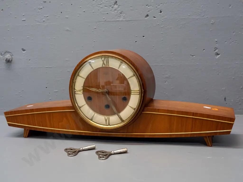 mid-century "Baduf" wood cased mantel clock with teak veneer and applied brass stringing, pressed brass & painted face. Image 1++
