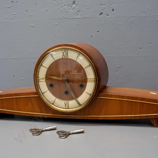 mid-century "Baduf" wood cased mantel clock with teak veneer and applied brass stringing, pressed brass & painted face.