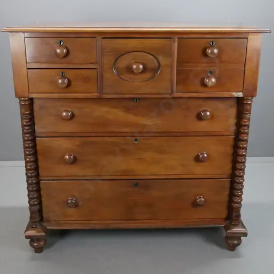 early colonial kauri break-front 7 drawer chest w/ bobbin-turned pilaster supports & turned wooden knobs, circular