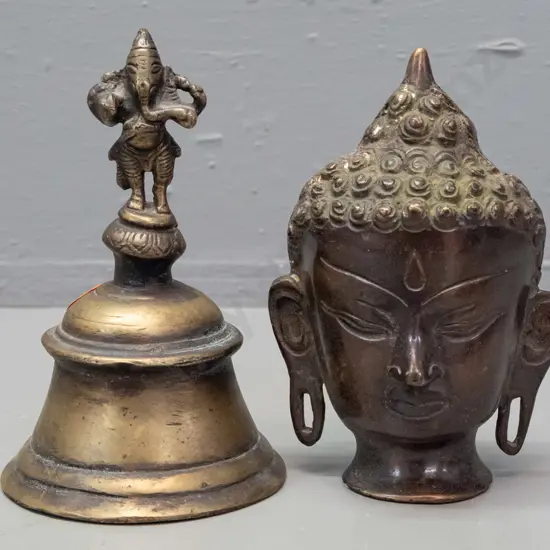 cast metal bell with elephant deity handle and a hollow cast metal Buddha head H-130