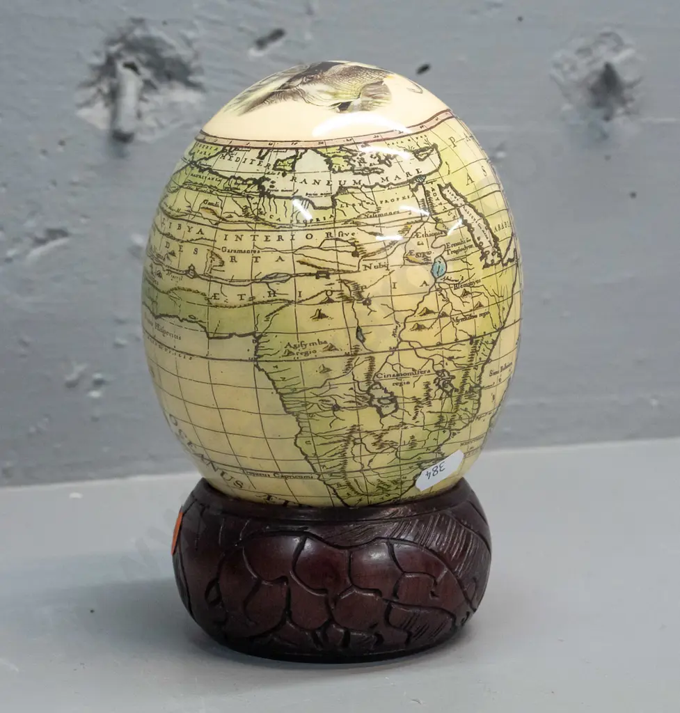 ostrich egg with transfer overlay on African animals and map on carved wood ring base with animal motifs. Combined H-200 Image 1++