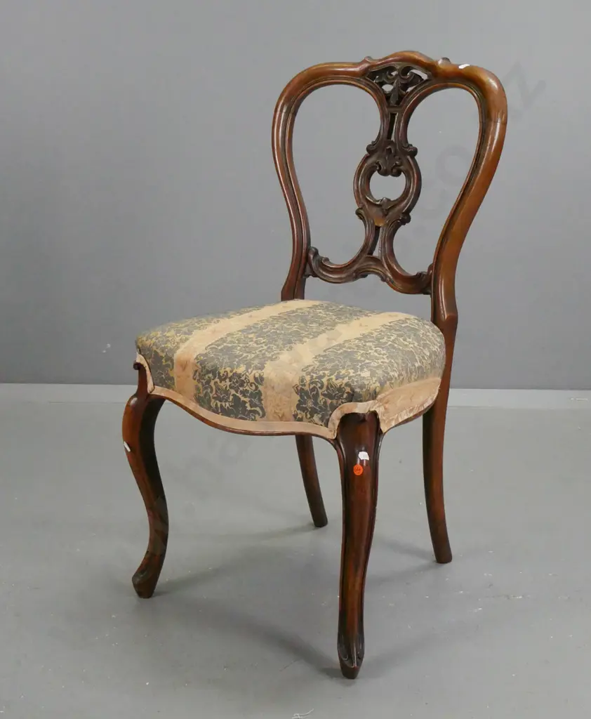 Victorian walnut side chair with foliate carved and pierced back on sweeping carved cab legs, with faded floral Image 1++