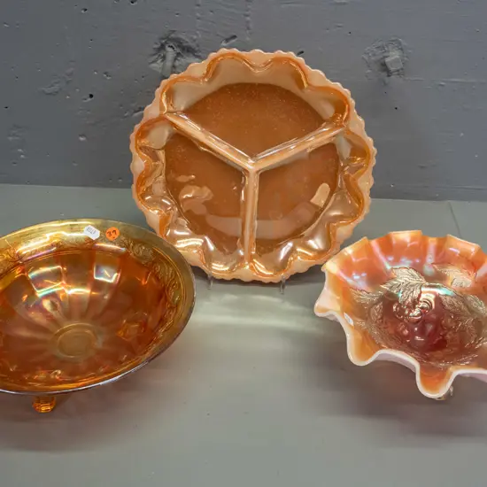 3 pieces marigold carnival glass - two 3-footed bowls & a segmented dish. 2 have white under-layer, tallest H-95 D-200